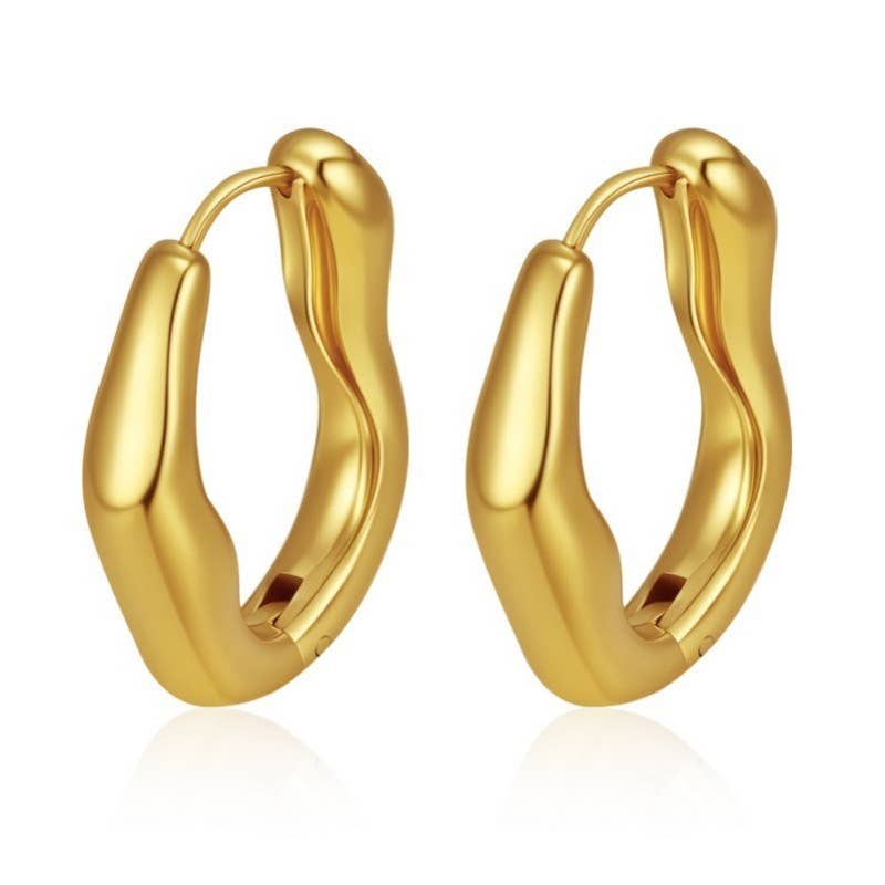 Gold hoop earrings on a white background