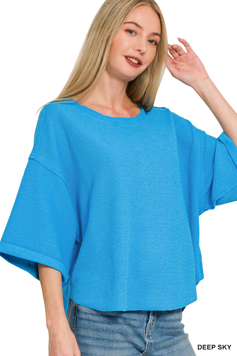 Woman wearing a blue top on a white background