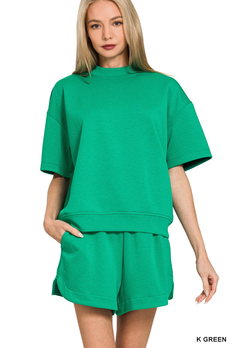 Woman wearing a green outfit on a white background